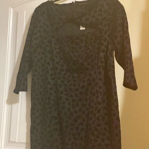 Black twist-neck dress.